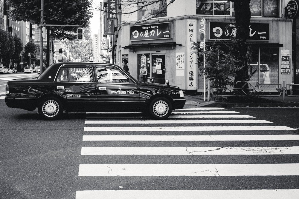 Iwatsuki Taxi on a street of Tokyo, in black and white - 1