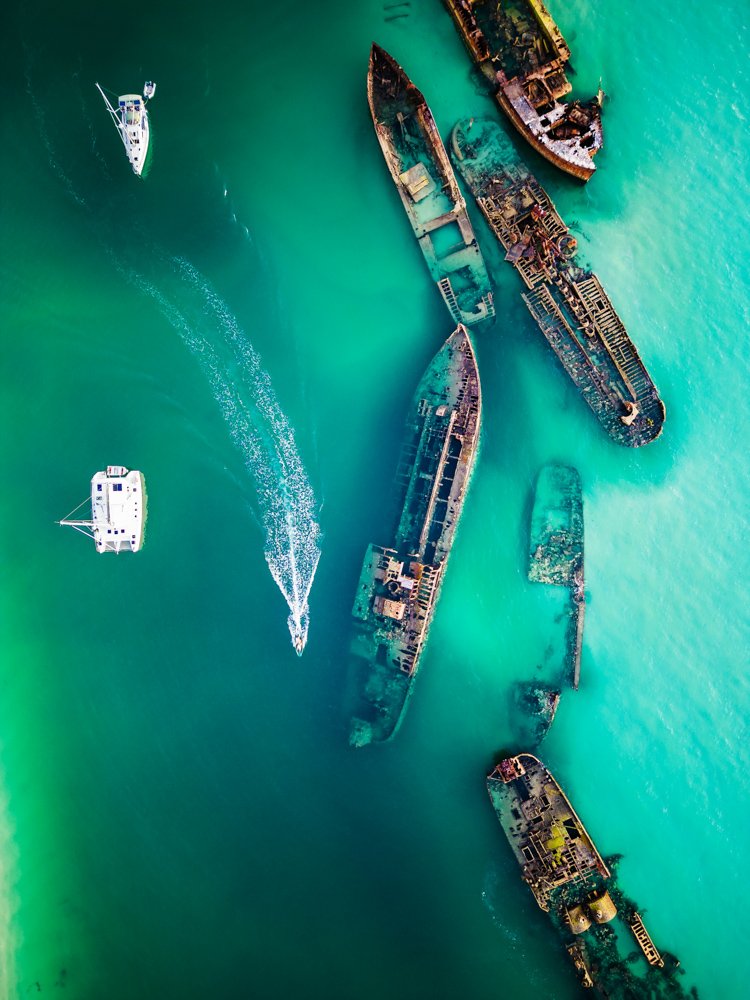 Shipwrecks in Moreton Island with passing Speedboat - 1